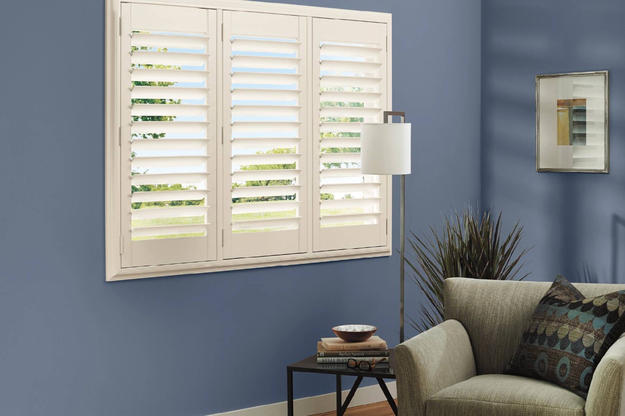 Small room with white Hunter Douglas Heritance® Wood Shutters covering the windows near Johnson City, Tennessee (TN)