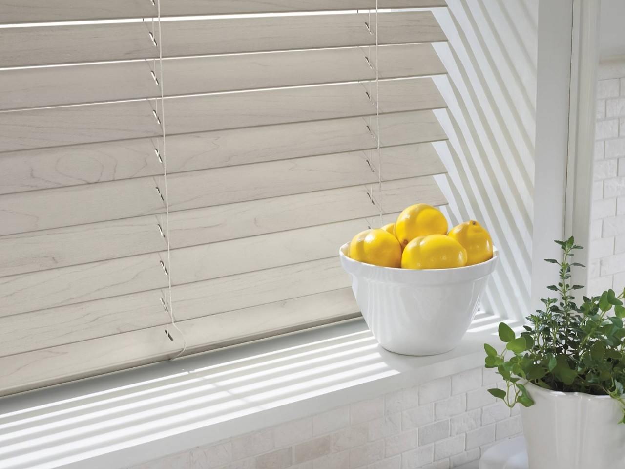 EverWood® Faux Wood Blinds as kitchen blinds with a bowl of lemons sitting on the windowsill at All About Blinds JC near johnson city, Tennessee (TN)