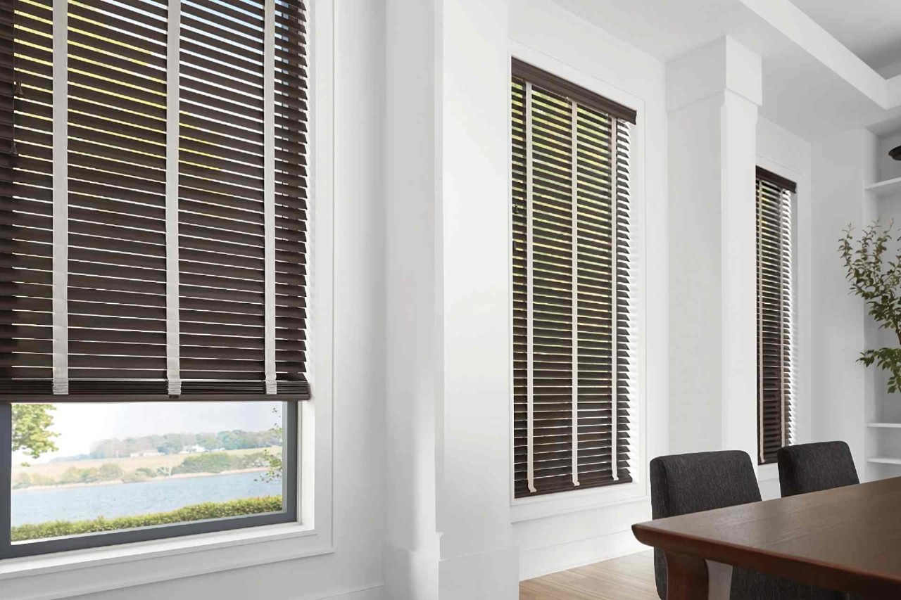  Hunter Douglas Parkland® Wood Blinds on three dining room windows with one pulled up some at All About Blinds JC near johnson city, Tennessee (TN)
