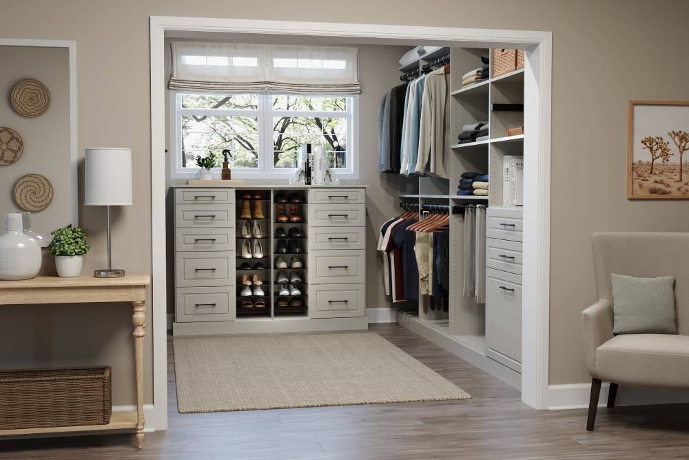 Custom closet full with lots of hanging clothes, along with some books, colognes, and drawers at All About Blinds near Johnson City, Tennessee (TN)